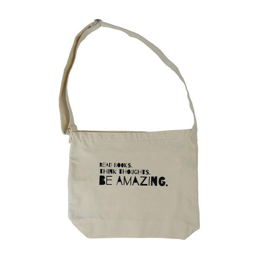 Beige tote bag with motivational text on a white background